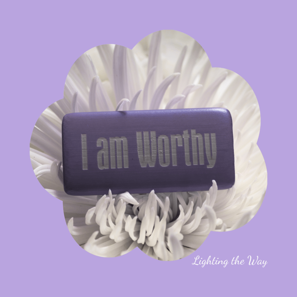 Worthy motivational message on an inside purple box, placed on a white chrysanthemum flower, with Lavender background.