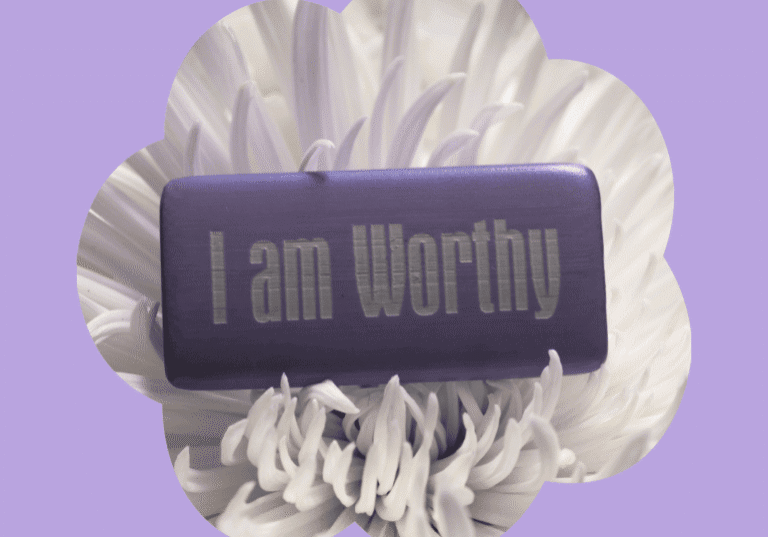 Worthy motivational message on an inside purple box, placed on a white chrysanthemum flower, with Lavender background.