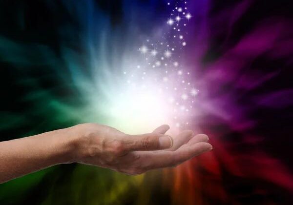 Vibrant multicolour magic lighting effect with a hand, symbolising innovative lighting solutions.